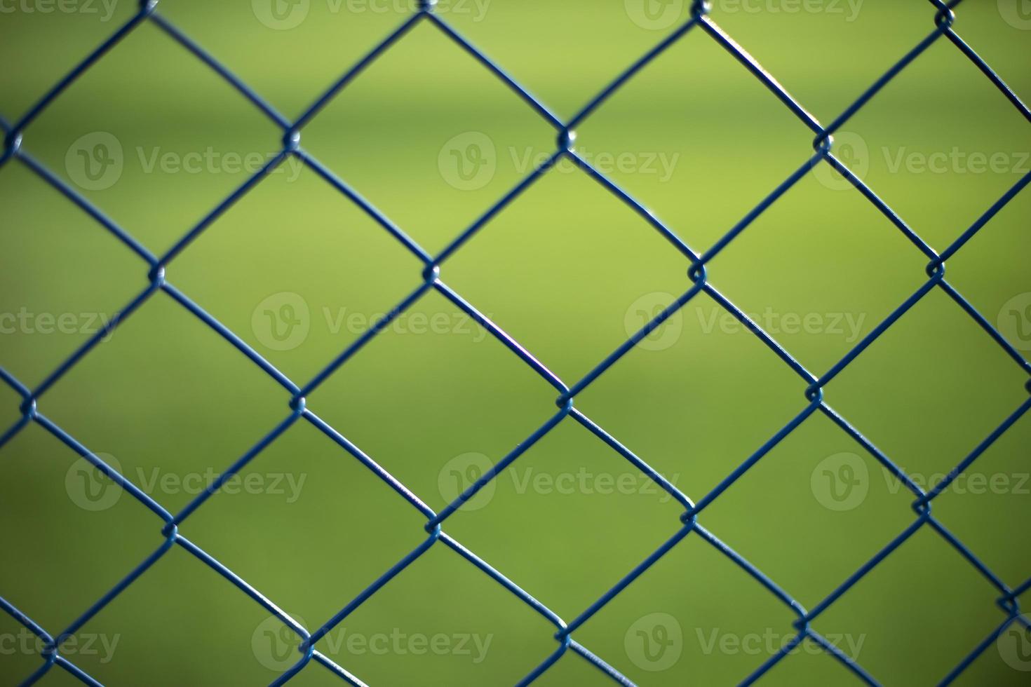 Fence net. Fence on green background. photo