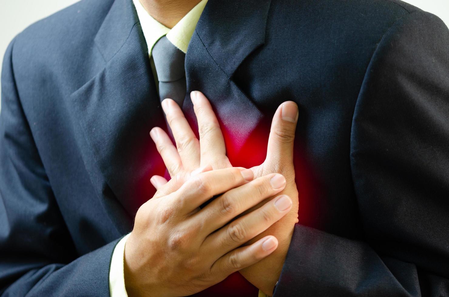 businessman has chest pain from work and anxiety. photo