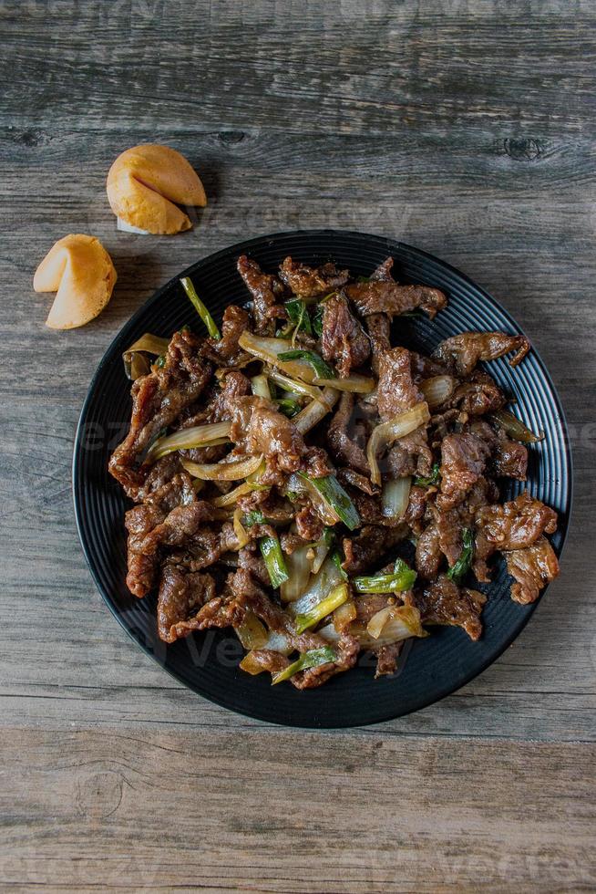 Chinese Mongolian beef with fortune cookies flat lay photo