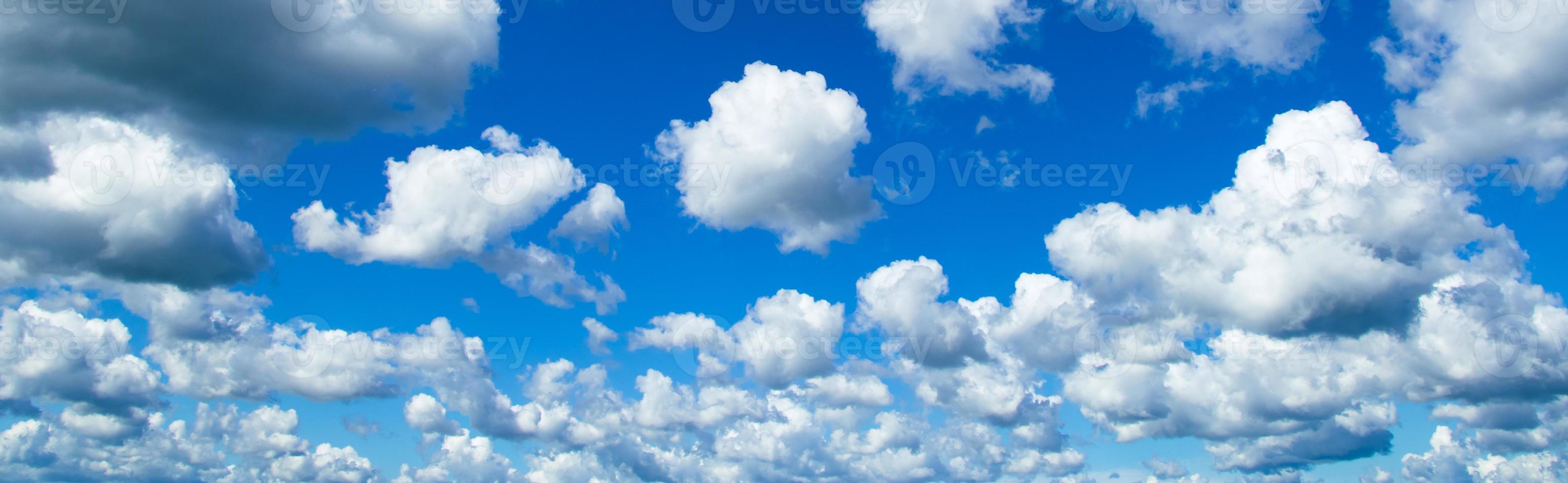 Beautiful summer blue sky. Fluffy white cumulus clouds. photo