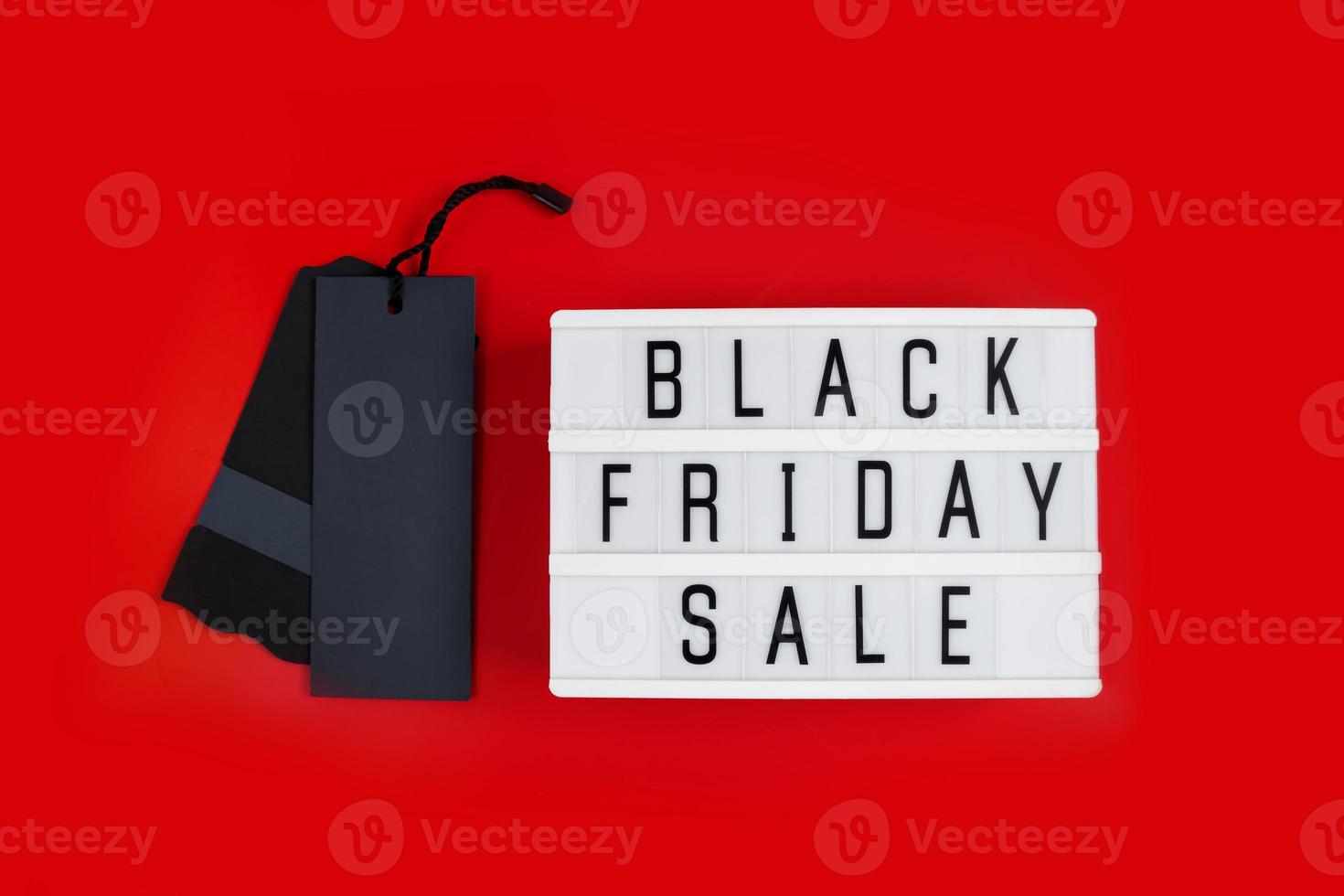 Black Friday sale concept. Label and lightbox on a red background. photo