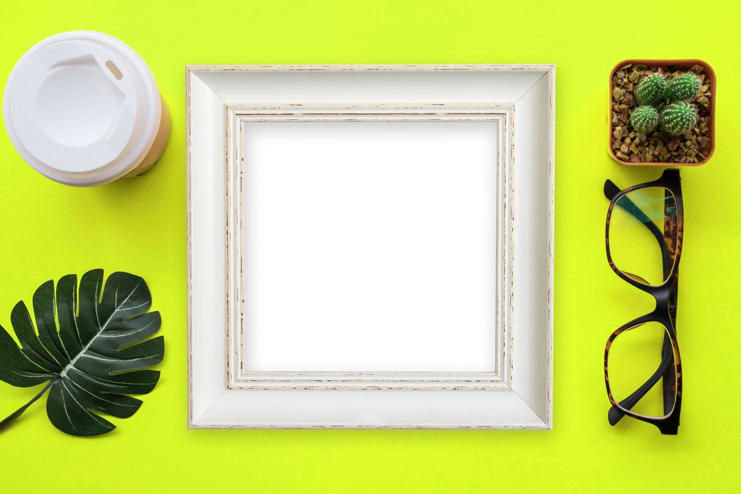 Design flat lay image of workspace desk with office supplies on yellow background. photo