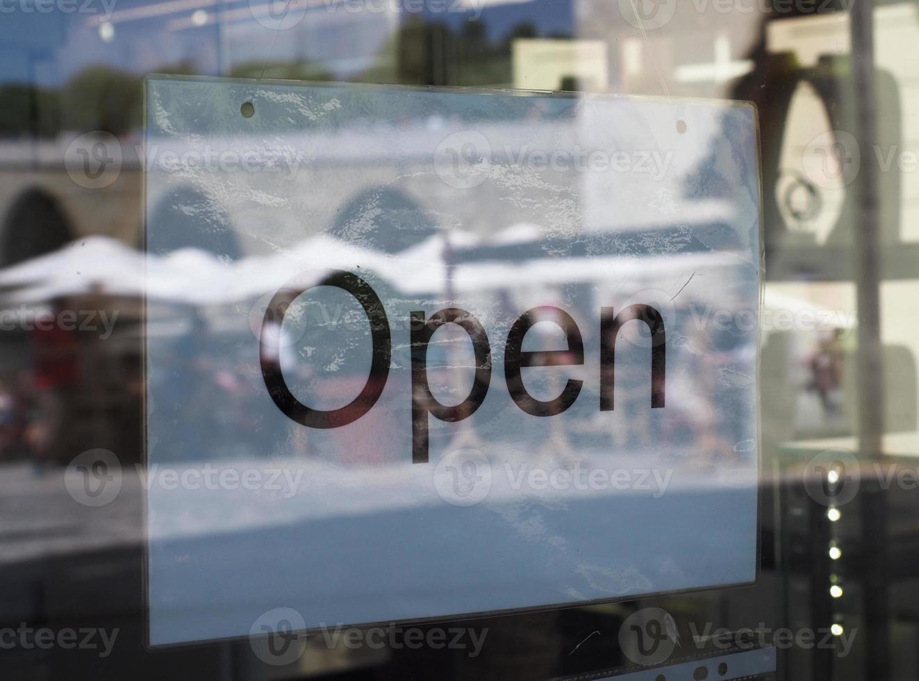 Open sign in shop window photo