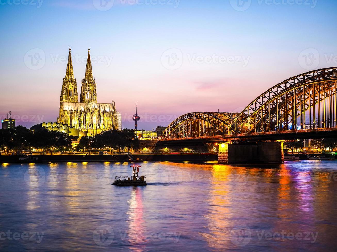 HDR St Peter Cathedral and Hohenzollern Bridge over river Rhine photo