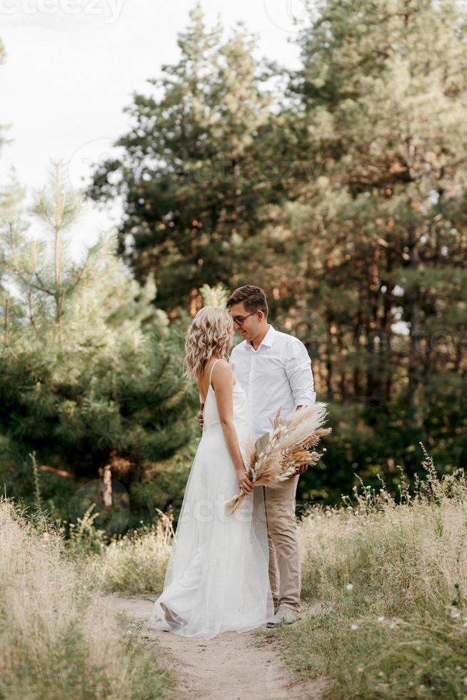 young couple of newlyweds on a walk photo