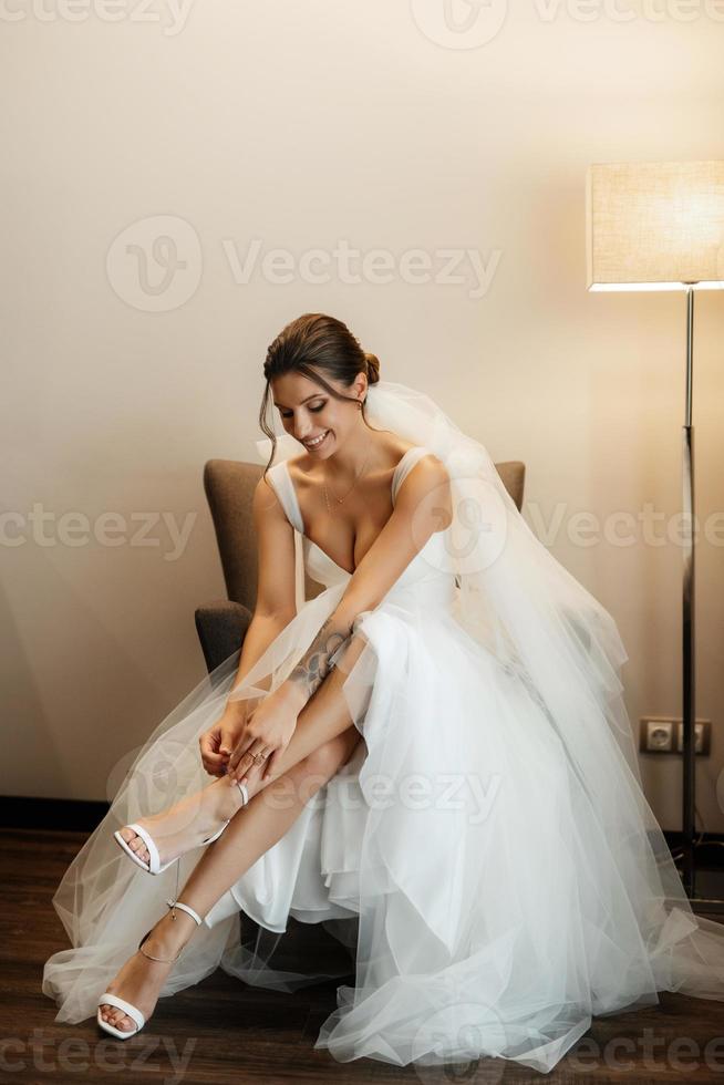 bride in a white dress at the training camp photo
