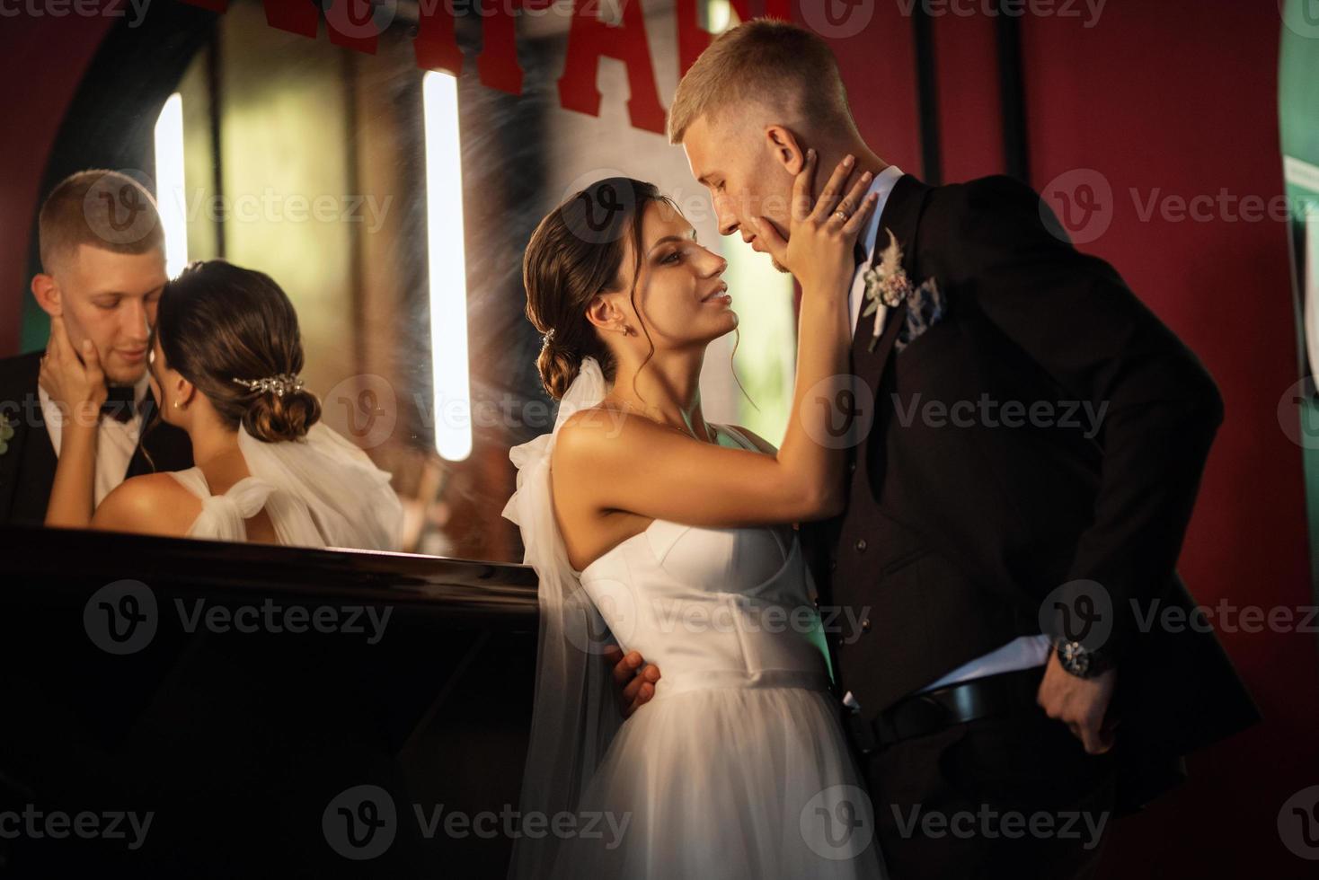 bride and groom inside a cocktail bar photo