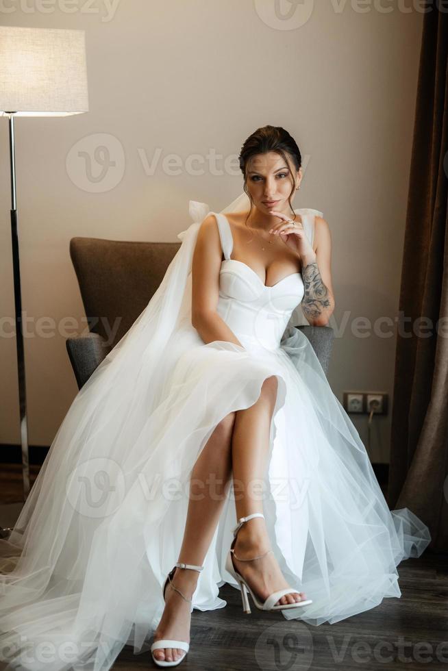 bride in a white dress at the training camp photo
