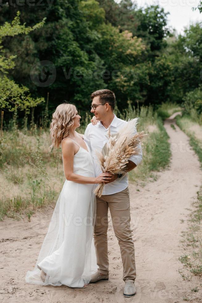 young couple of newlyweds on a walk photo