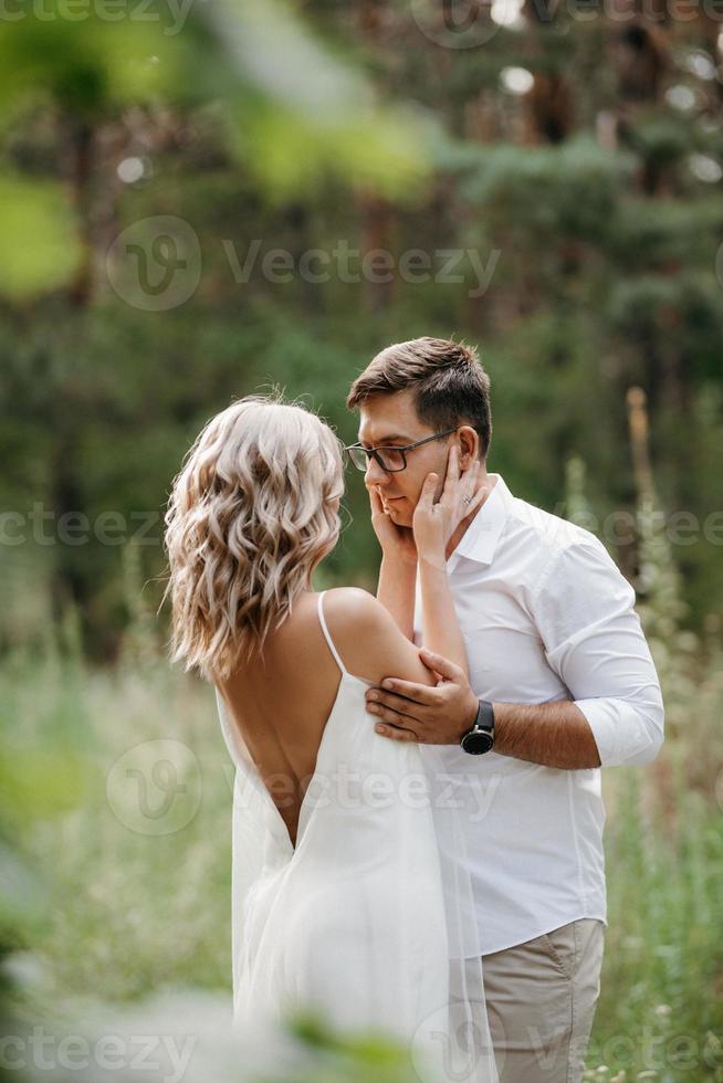 young couple of newlyweds on a walk photo