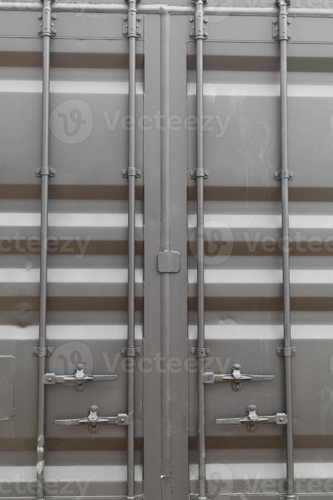 Standard cargo container in matt black and has a key to lock the rear door securely to prevent lost and thieves. photo