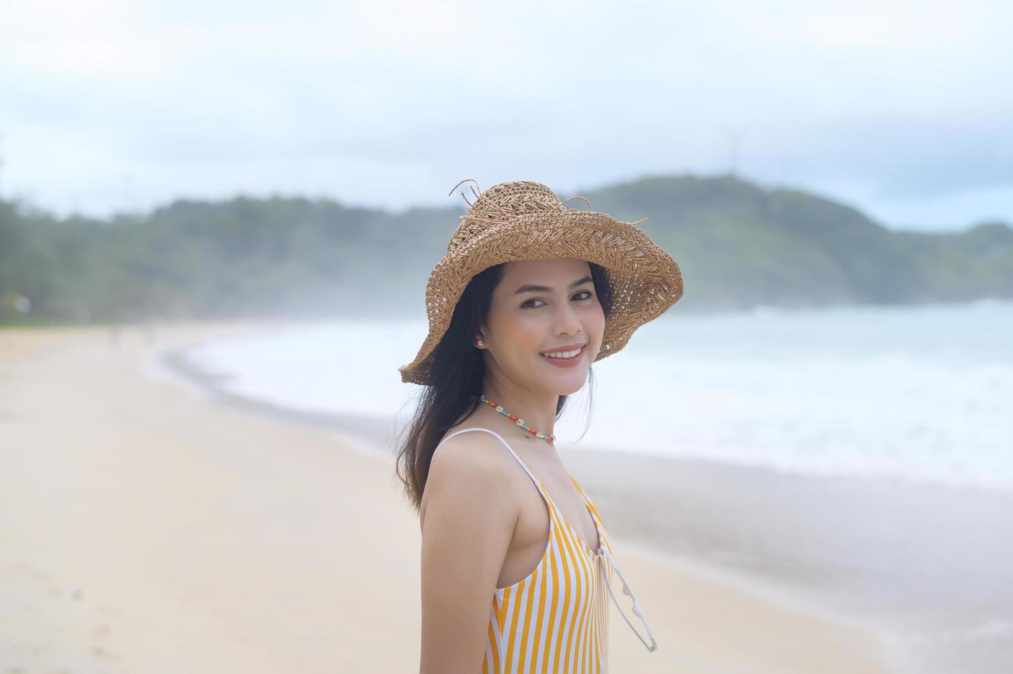 Young Beautiful woman in Bikini enjoying and relaxing on the beach,  Summer, vacation, holidays, Lifestyles concept. photo