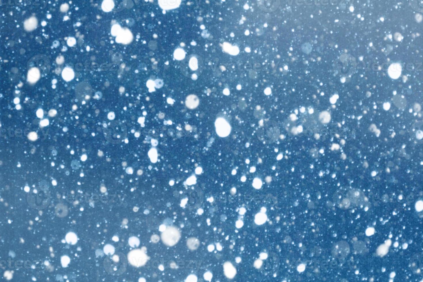 Falling snow. snowfall. Blurred. Abstract festive Christmas background. Winter holiday texture. photo