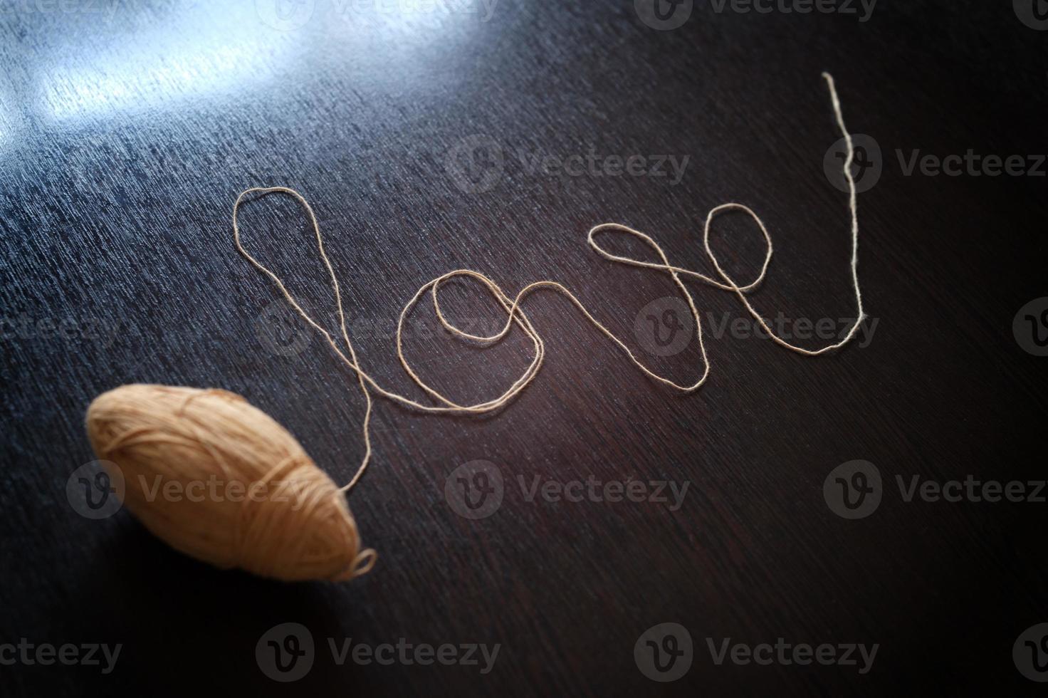 Word love of yarn ball for sweetheart . Concept Valentine's day , wedding photo