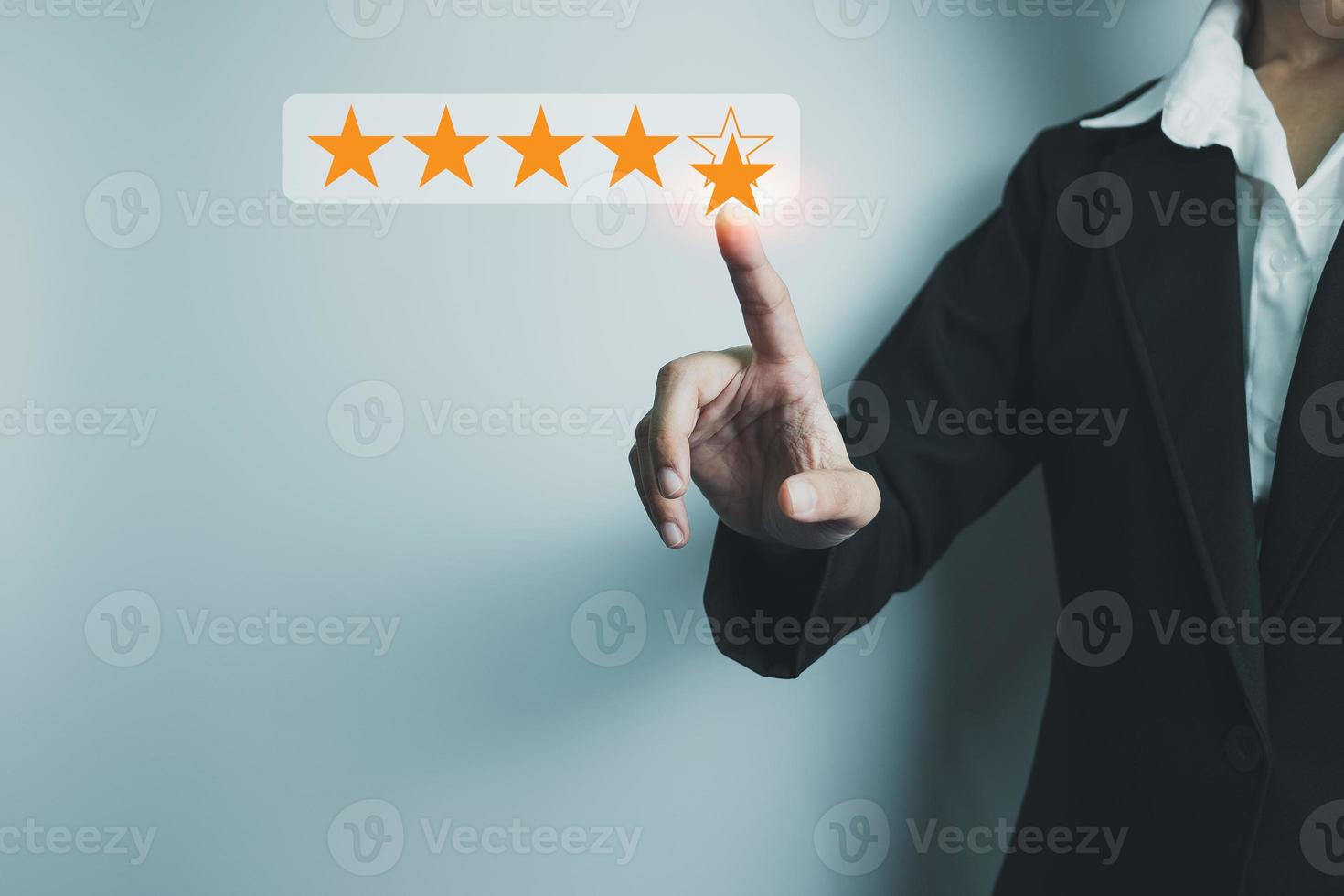 Businesswoman showing the symbol of top service 5 star quality assurance, excellent warranty, world standard, ISO certification, development and improve the quality of the organization concept. photo