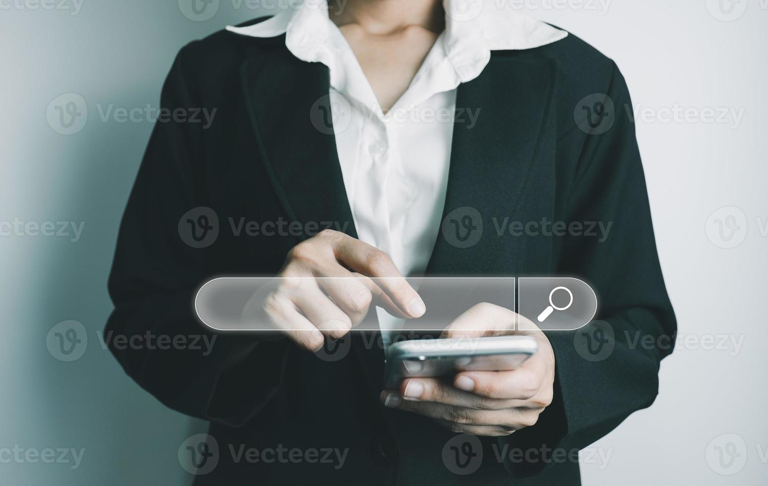 Search Engine optimization SEO concept, Businesswoman is using smartphone to search for information on Internet, Using the search bar, Wireless Network, big data and accessing website information. photo