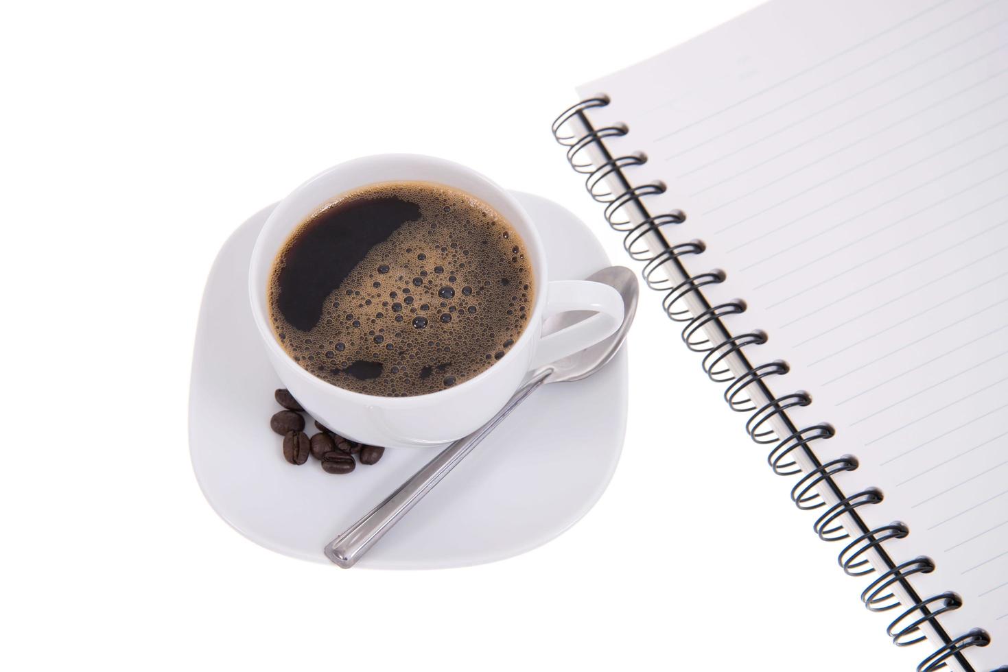 cup of coffee isolated with notebook lined papers photo