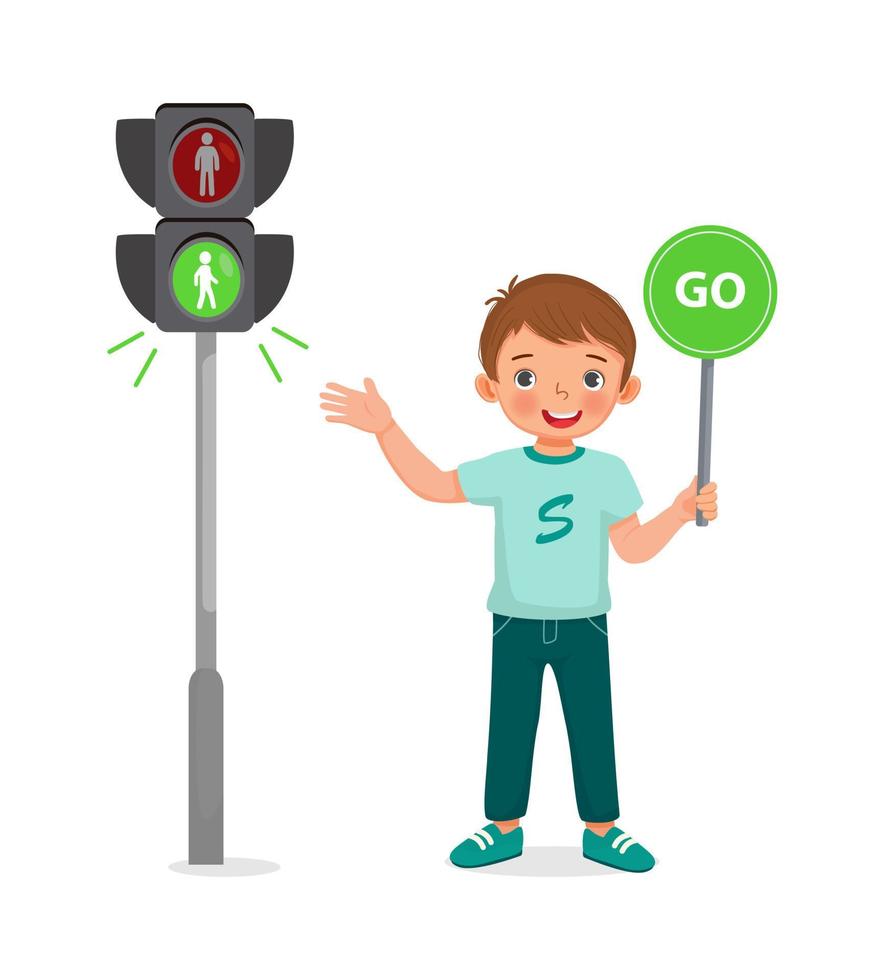 cute little boy holding go sign near pedestrian traffic light with indicator green light on vector