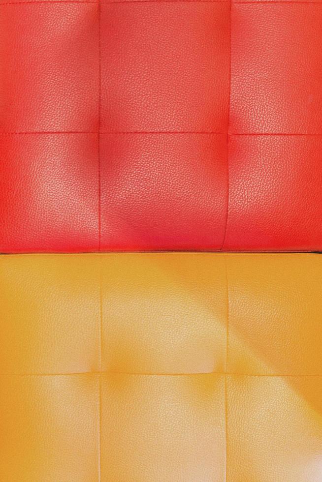 Red and orange sofa cover lather texture background photo