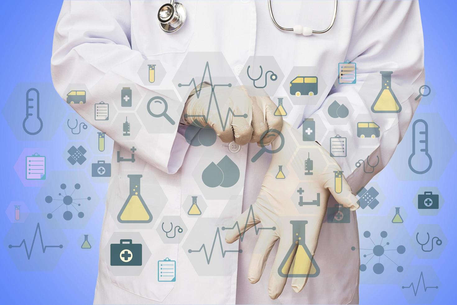 Male doctor is putting glove with medical icons overlay photo