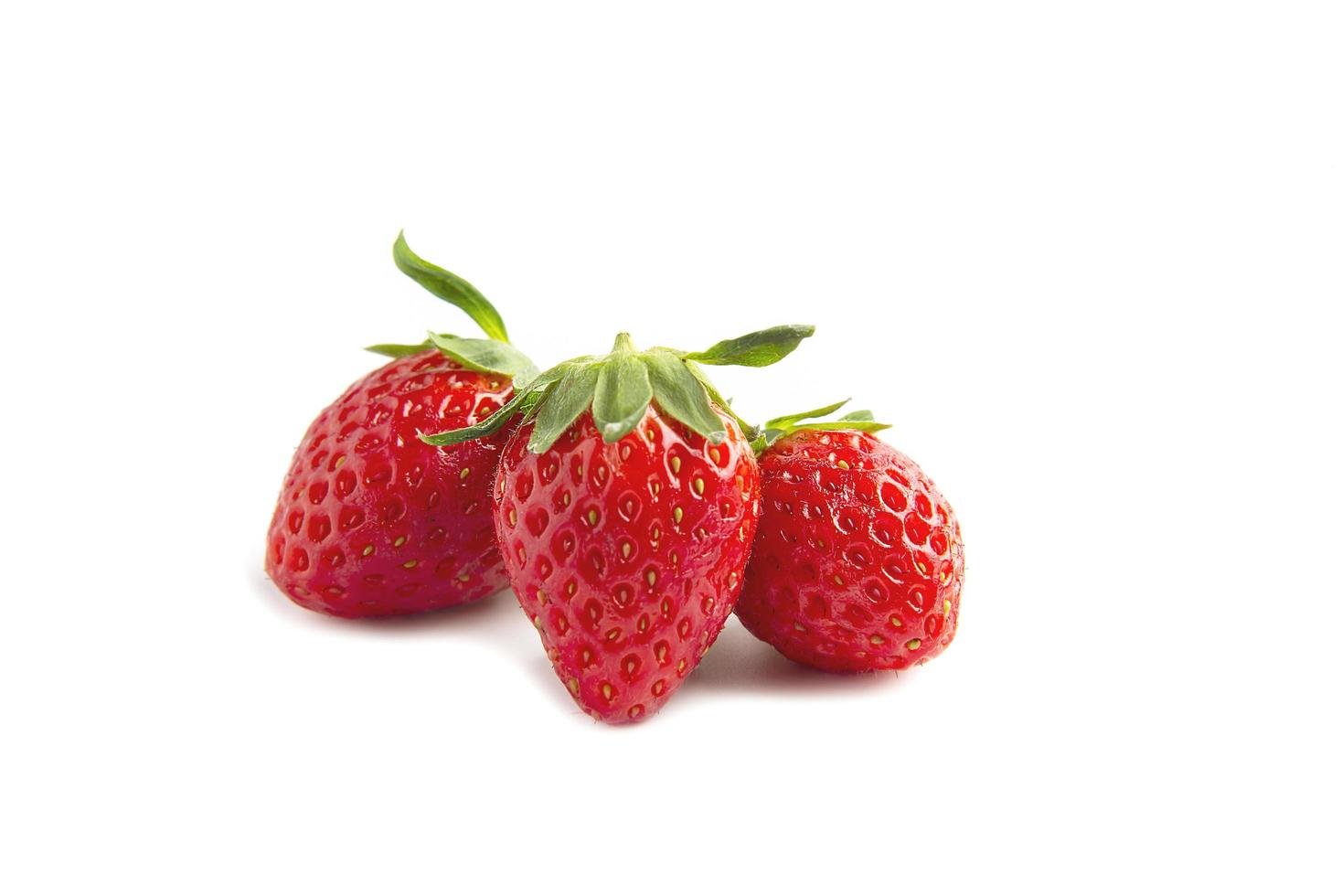 Fresh ripe strawberries isolated over white background - colorful bright strawberries concept photo