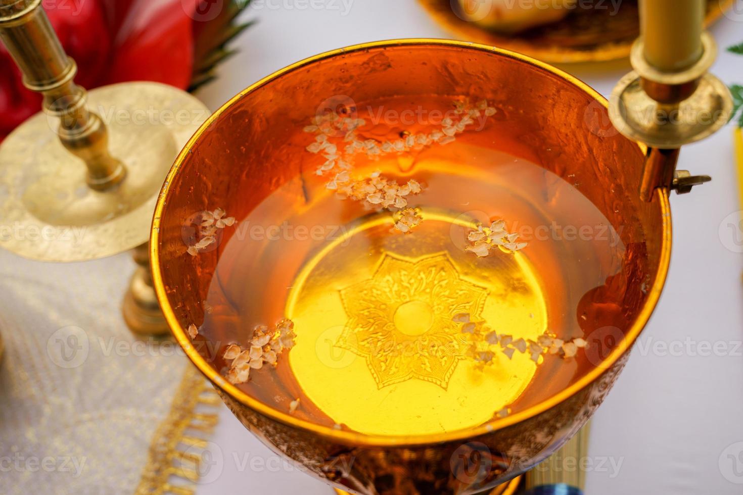 holy water in Thai gold pan photo