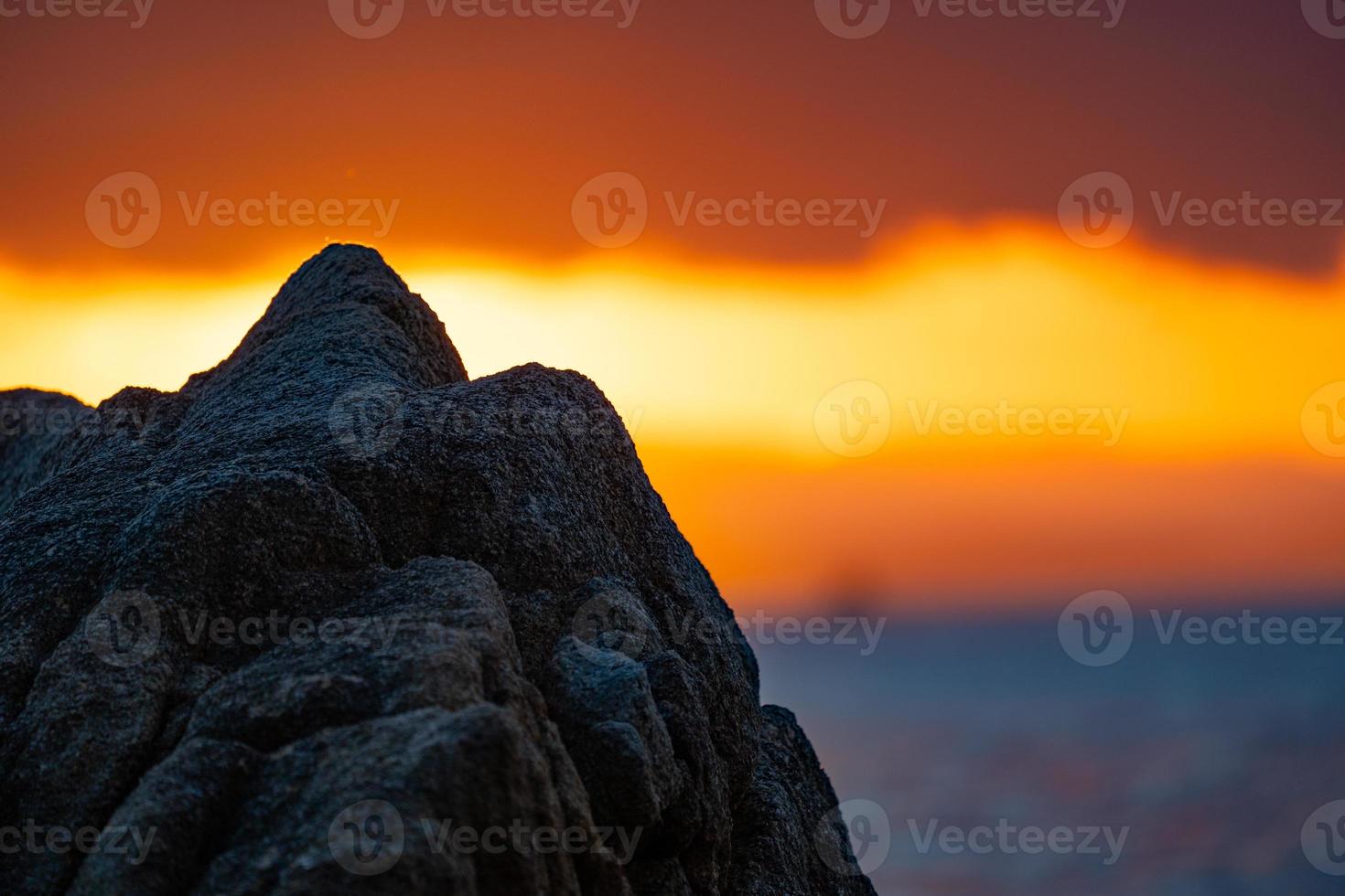 Close up the Foreground rock front of the Thailand sea in twilight time. photo