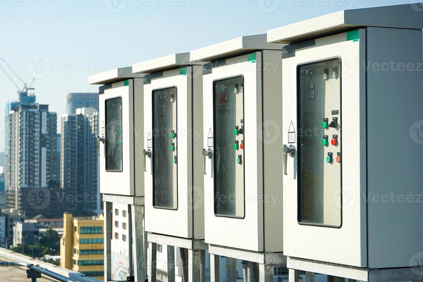 electric box control at the building rooftop with blur building background. photo