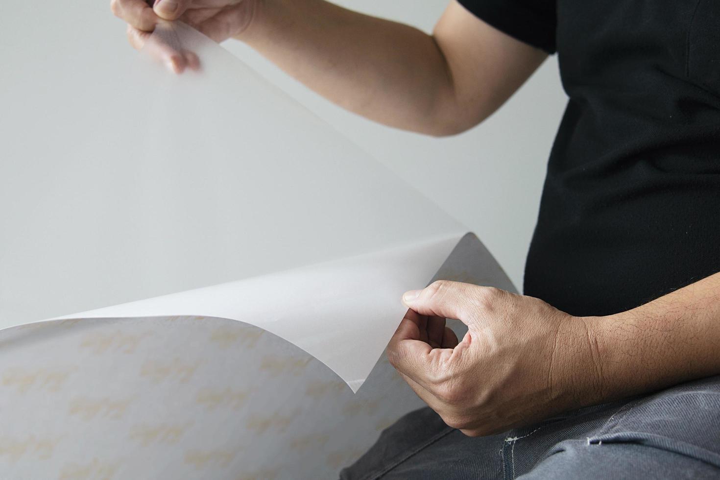People installing sticker film to mirror window house interior decoration photo