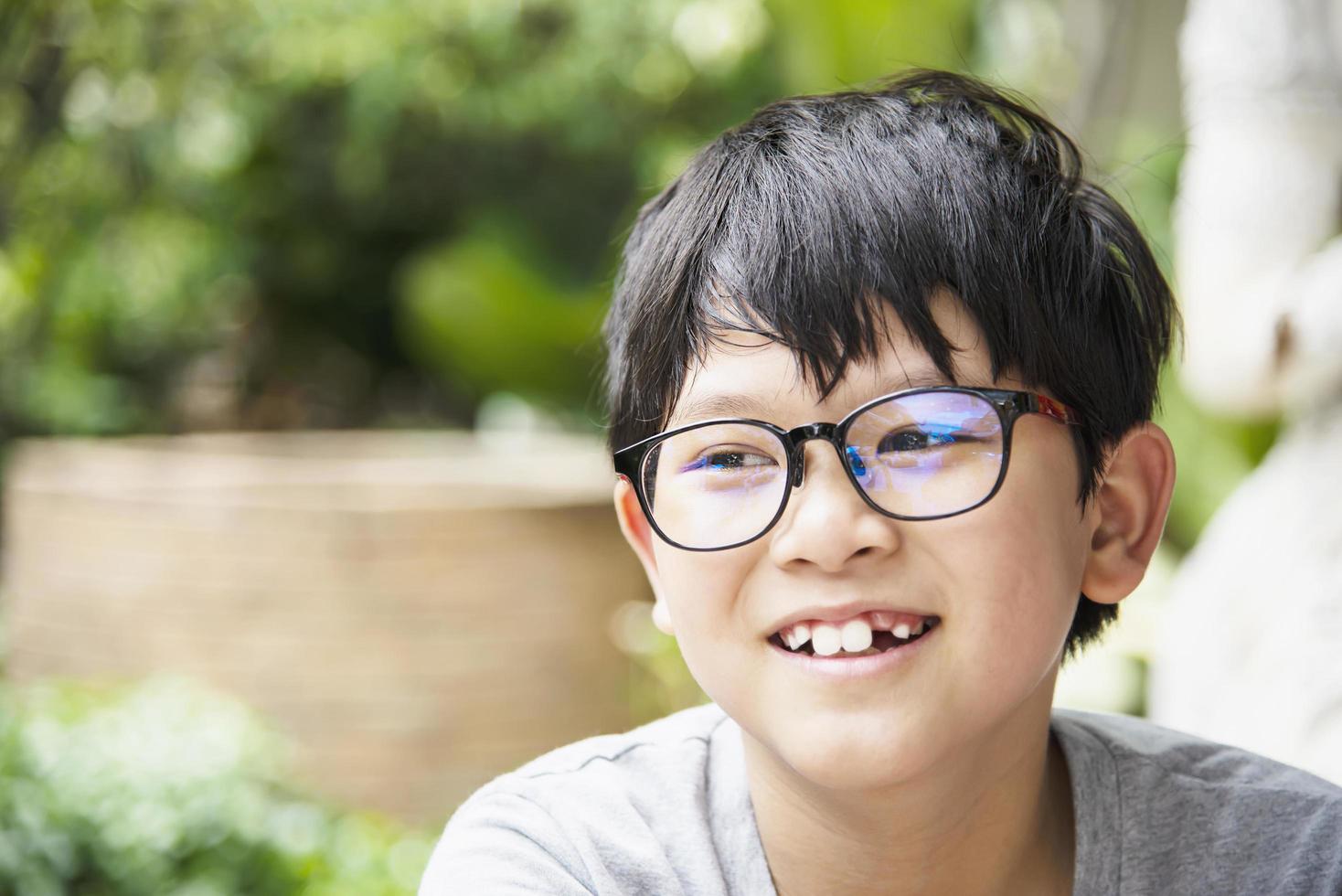 Young Thai boy smiling portrait - happy Asian boy concept photo