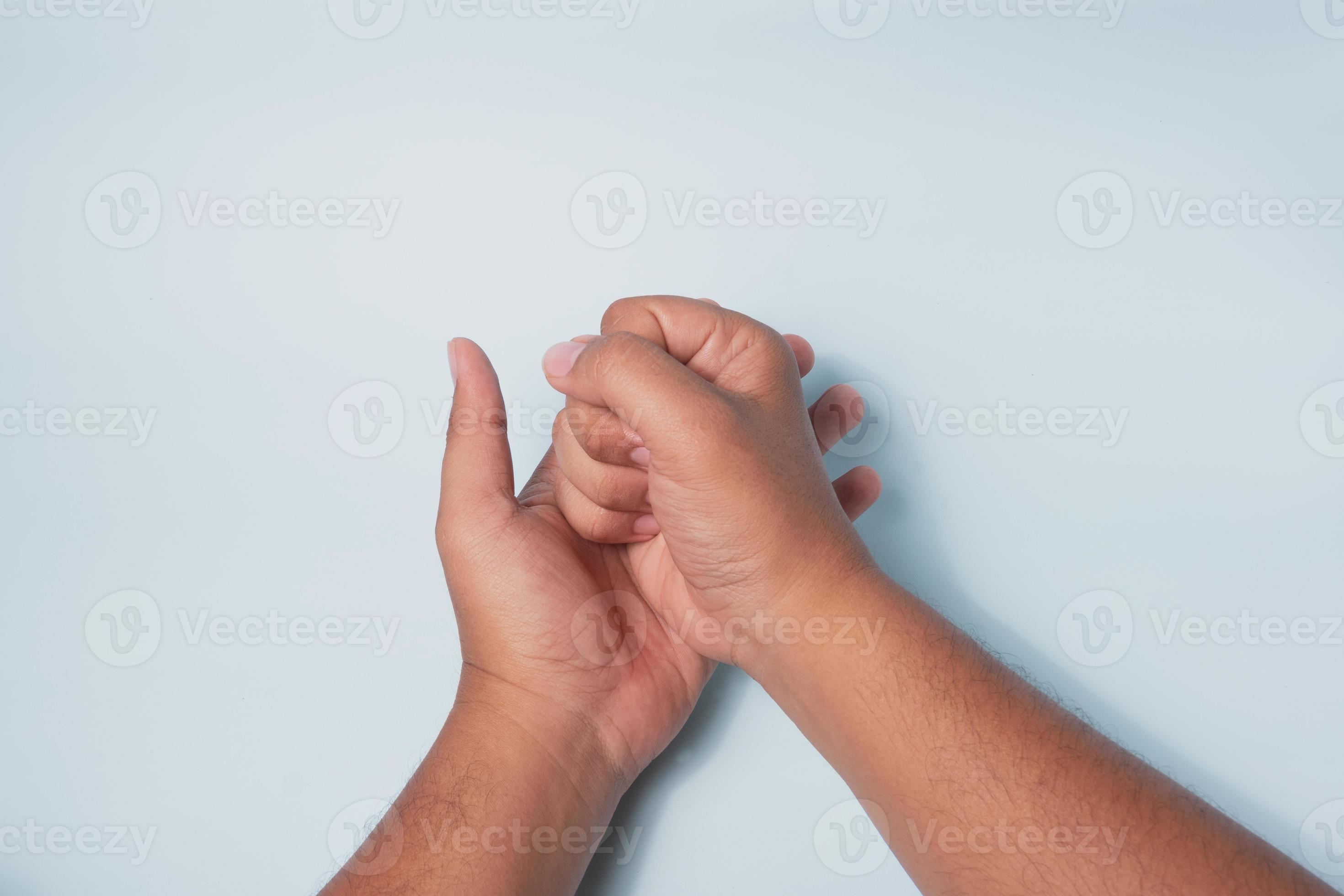 hand gesture clenching and hitting the palm of the hand, the concept of