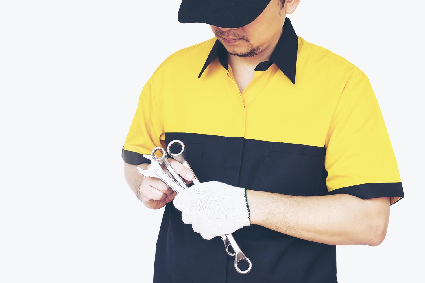 Mechanic man isolated over white photo