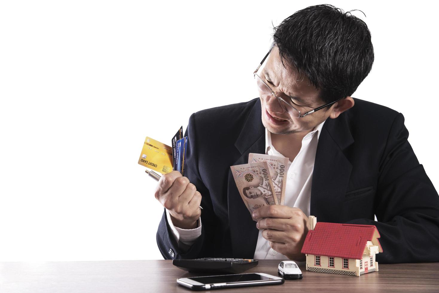 Thai man serious with financial problem, Covid-19 bad business effect concept photo