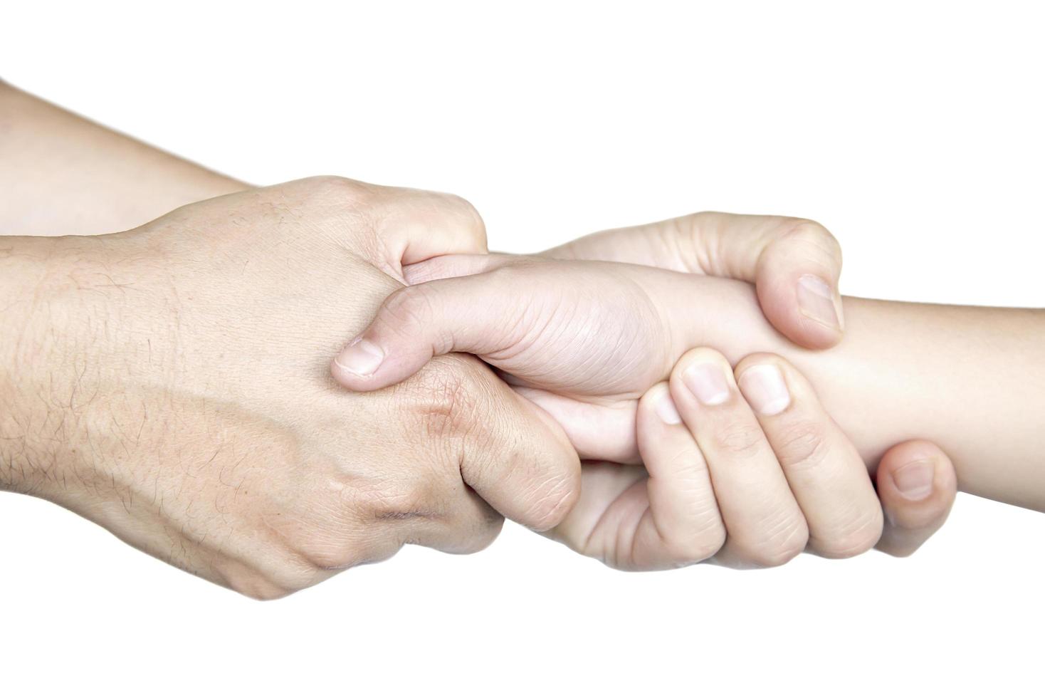 Father gentle holding son's hand over white background - people love help care each other concept photo