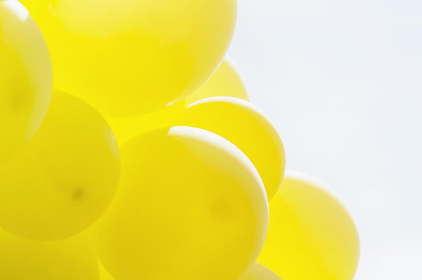 Yellow balloon with blue bright sky background photo