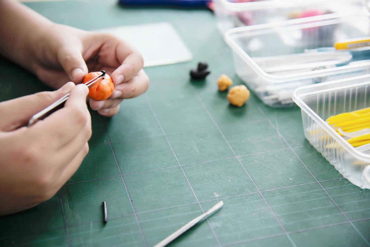 Boy is playing polymer clay photo