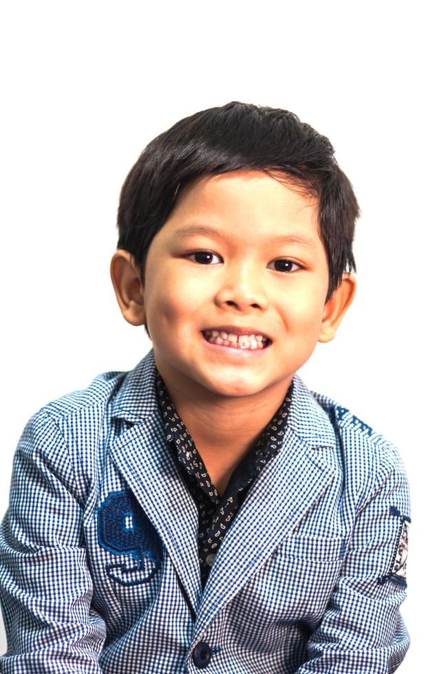 Asian 6 years old boy expresses happy smiling isolated over white  background photo