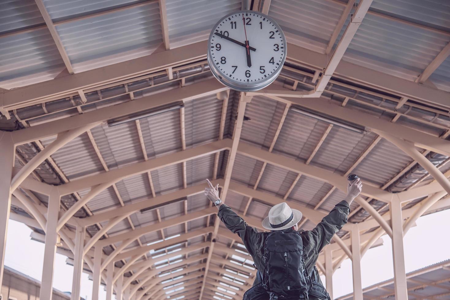 Travel man is waiting train at train station, Chiangmai Thailand, 23 May 2019 photo