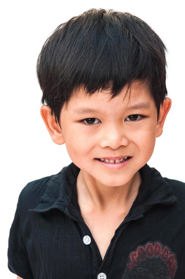 Portrait of smiling boy over white background photo