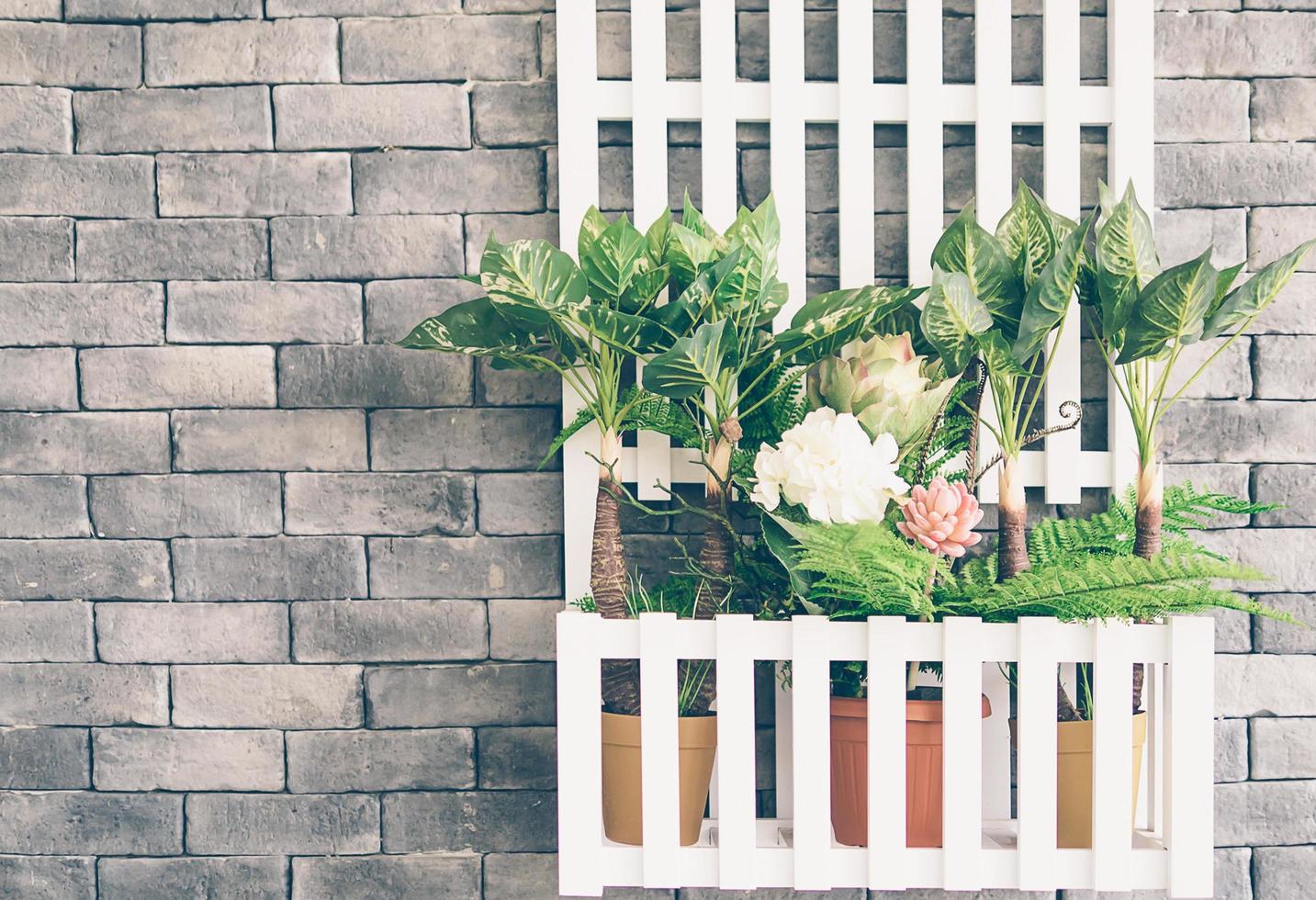 Vintage photo style of wooden hanging flower basket on gray wall background