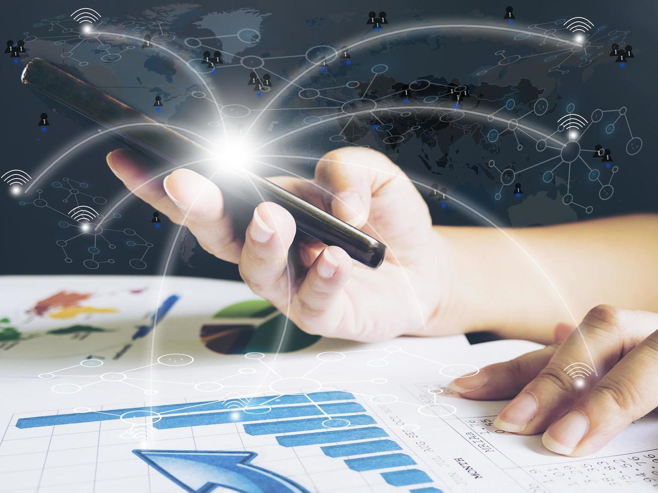 Lady is using mobile telephone to run her worldwide business, internet financial technology fintech concept. photo
