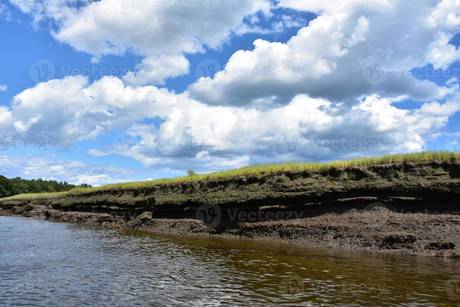 Fluffy White Clouds on a Spring Day Over North River photo