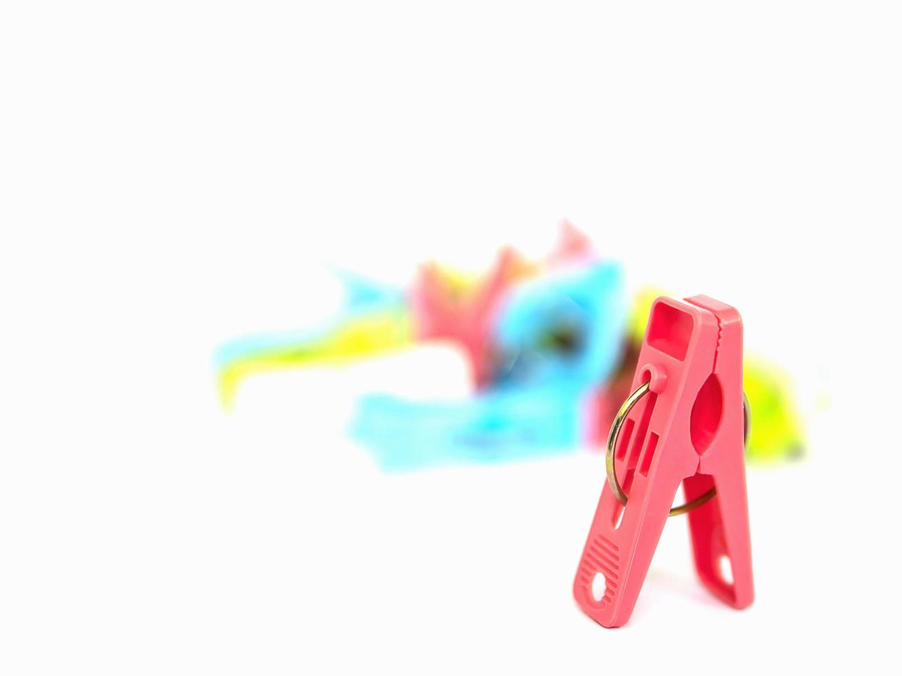 Colorful plastic clothespins isolated over white photo
