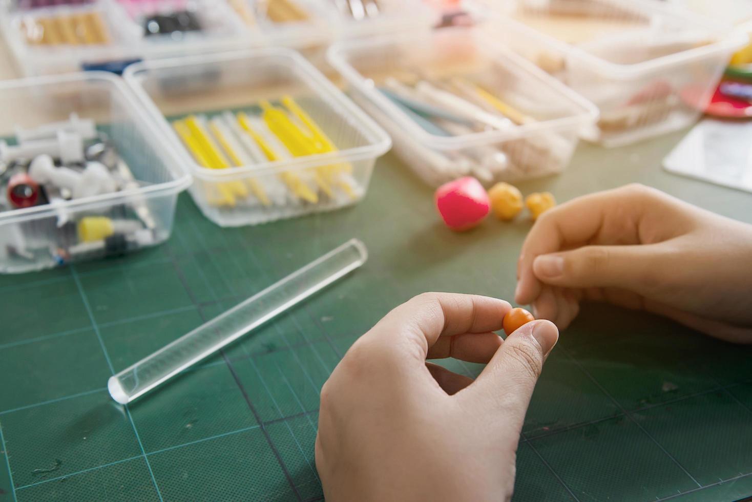 Boy is playing polymer clay photo