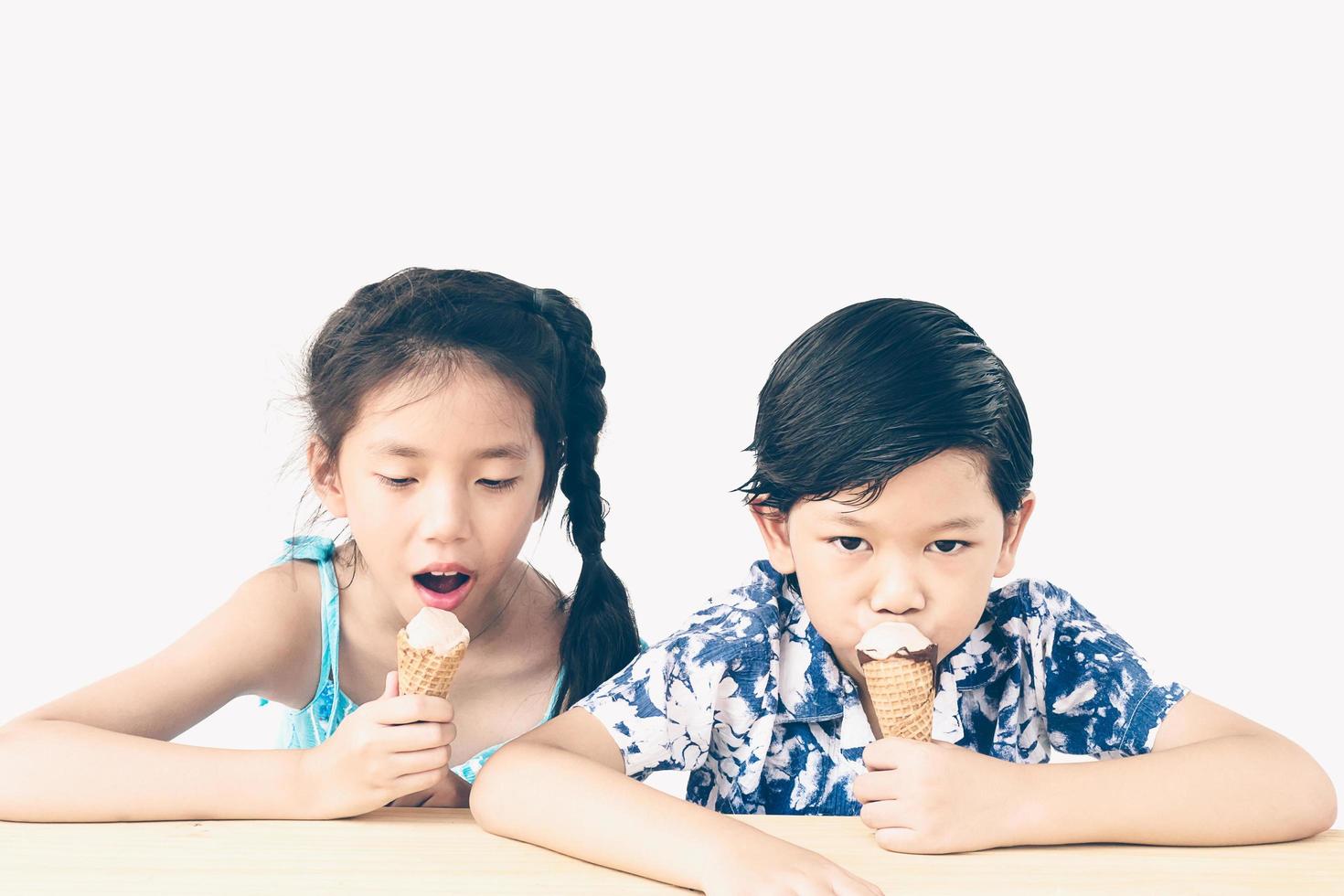 Vintage style photo of asian kids are eating ice cream