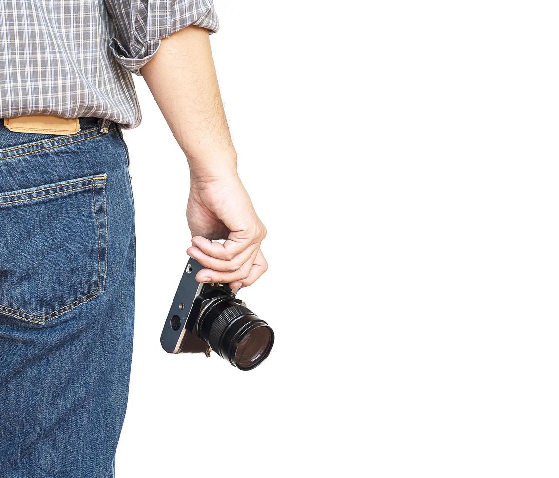 Man holding film camera ready to take photo over white background