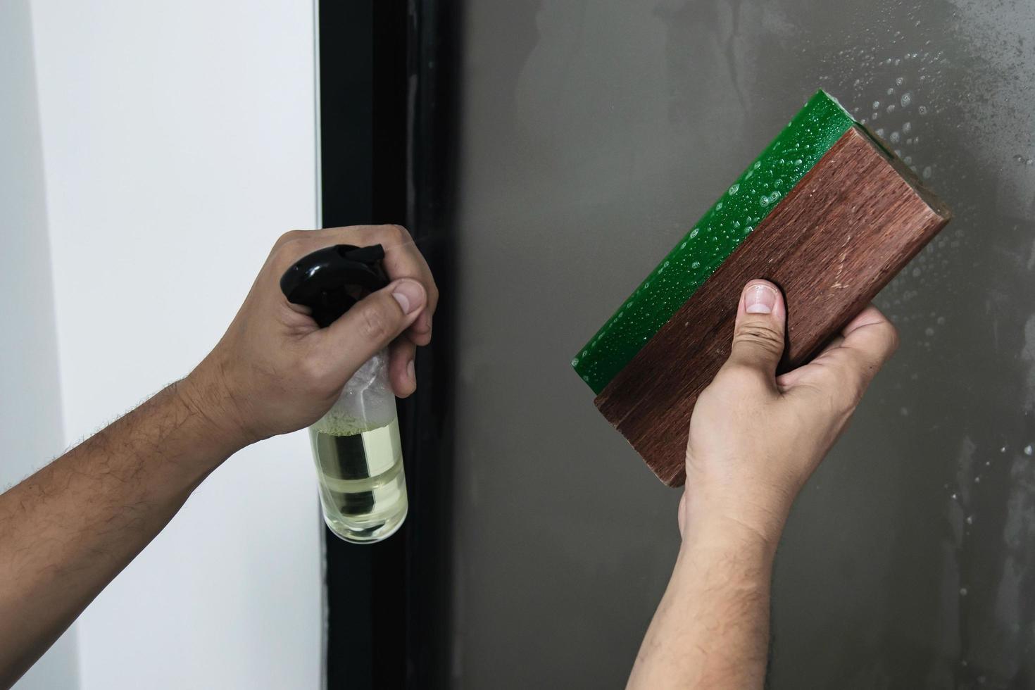 People installing sticker film to mirror window house interior decoration photo