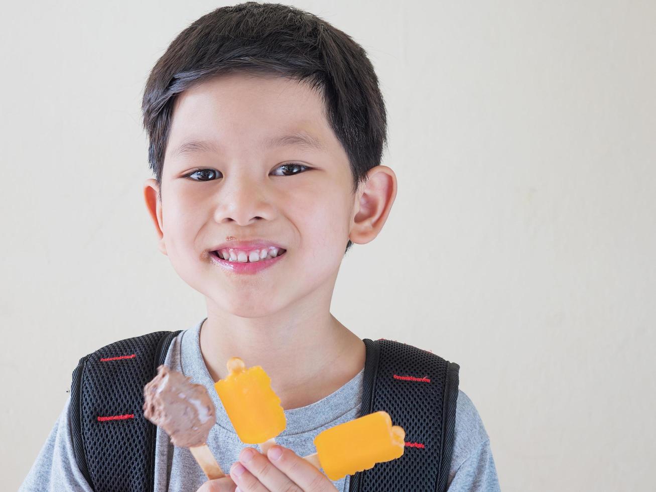 Boy eating ice cream. Photo is focused at his eyes.