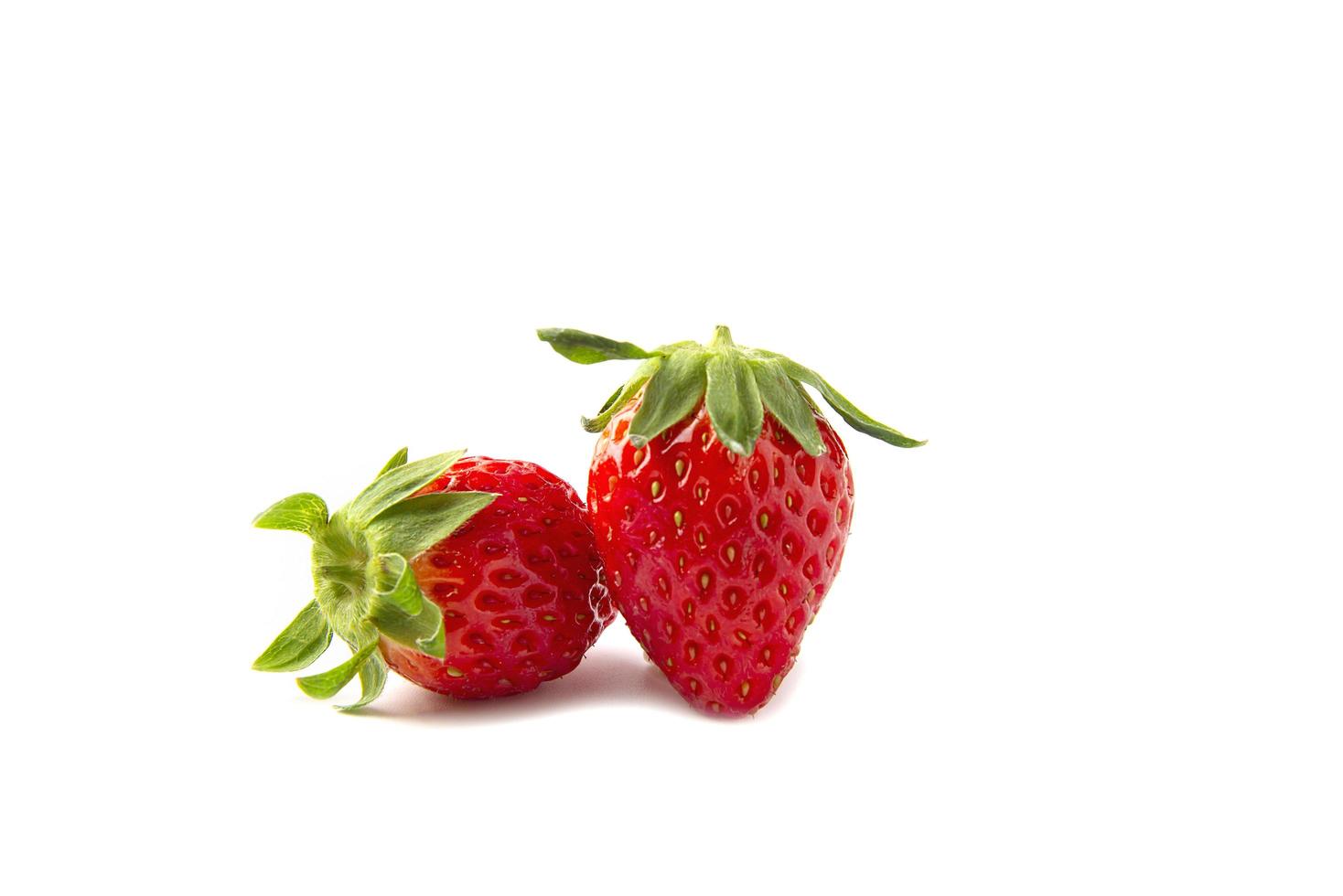 Fresh ripe strawberries isolated over white background - colorful bright strawberries concept photo