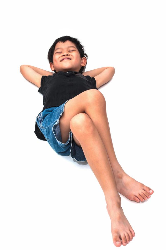 Isolated of relaxing boy lay down on the floor photo